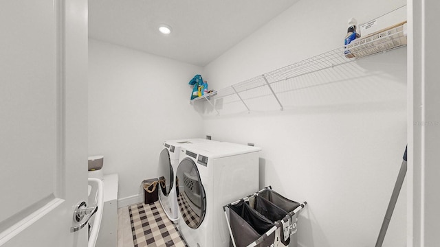 laundry area with independent washer and dryer