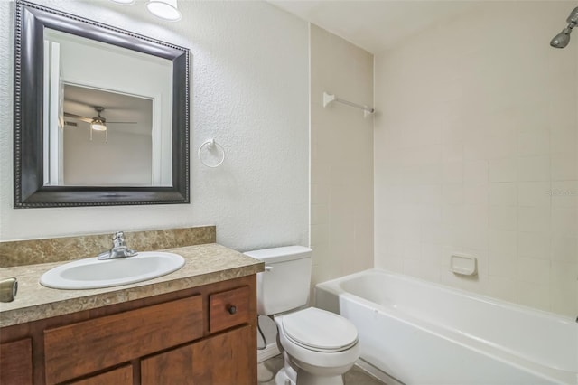 full bathroom with vanity, toilet, and tiled shower / bath combo