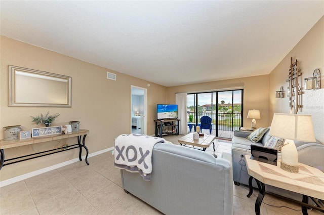 living room featuring light tile patterned flooring