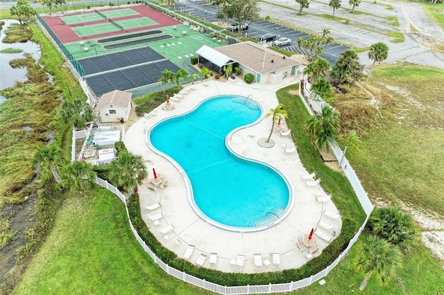 view of swimming pool with a lawn and a patio area