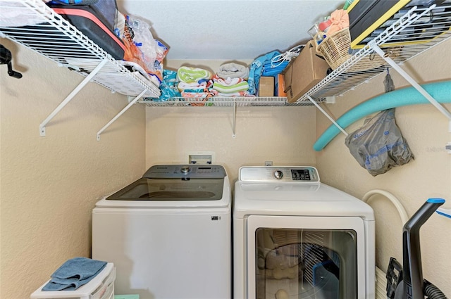 laundry room with independent washer and dryer