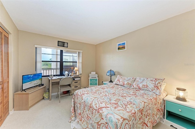 carpeted bedroom with a closet