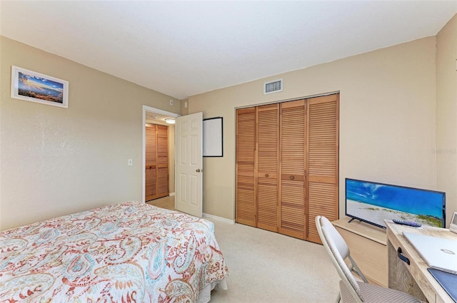 bedroom with light carpet and a closet