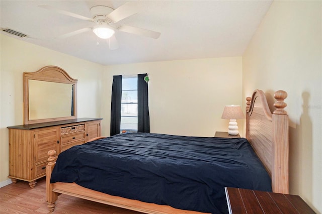 bedroom featuring wood-type flooring and ceiling fan