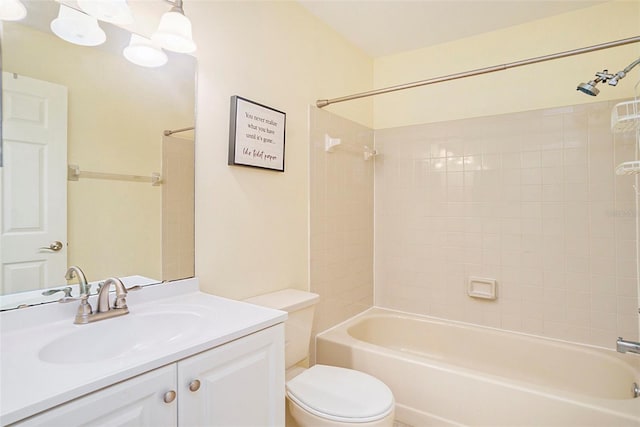 full bathroom featuring vanity, toilet, and tiled shower / bath combo