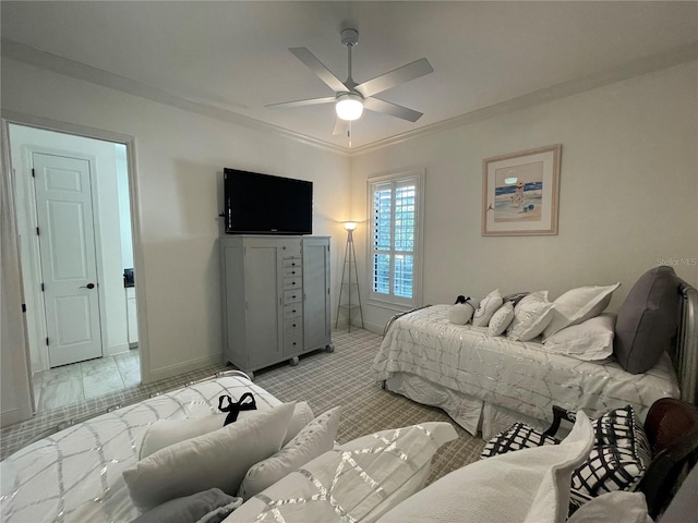 carpeted bedroom with ceiling fan and ornamental molding