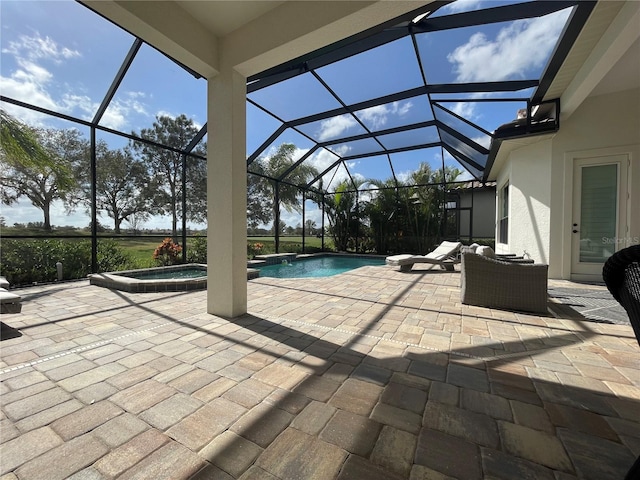 view of swimming pool with an in ground hot tub, a patio, and glass enclosure