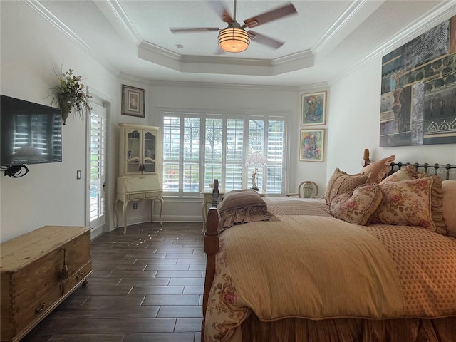 bedroom featuring access to outside, a raised ceiling, ceiling fan, dark hardwood / wood-style floors, and ornamental molding