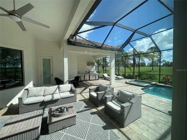 view of patio / terrace with a pool with connected hot tub, a ceiling fan, an outdoor living space, and exterior kitchen