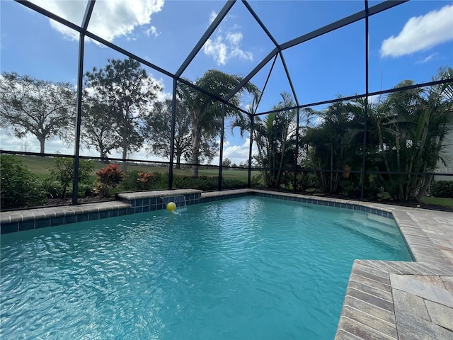 pool with glass enclosure and a patio