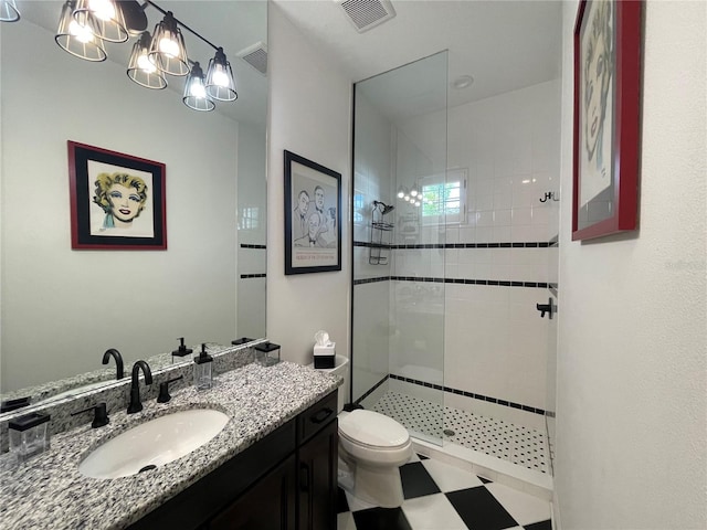 full bath with toilet, visible vents, tiled shower, and vanity