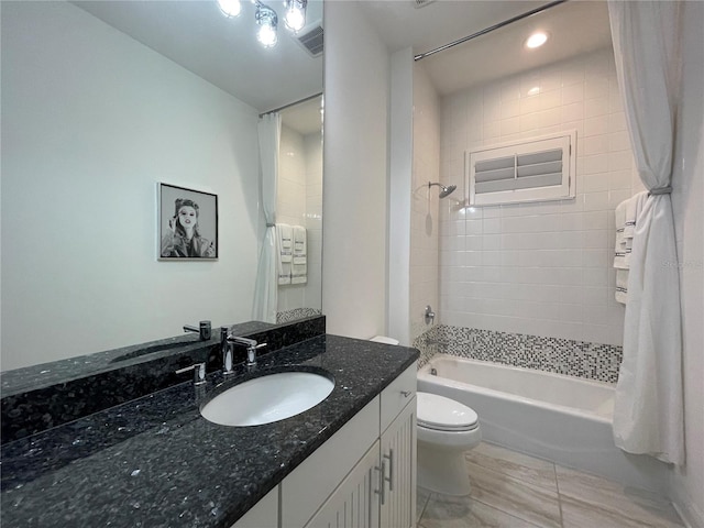 full bath featuring washtub / shower combination, visible vents, vanity, and toilet