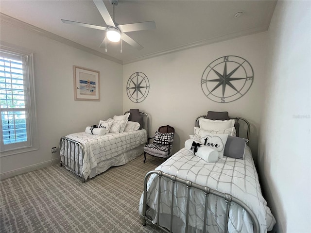 bedroom with carpet floors, ornamental molding, baseboards, and a ceiling fan