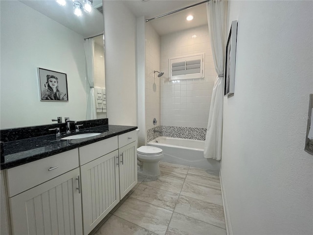 full bathroom featuring toilet, marble finish floor, shower / bath combination, and vanity