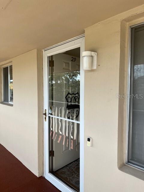 3751 S School Ave Unit 29, Sarasota, FL 34239 - property entrance featuring stucco siding