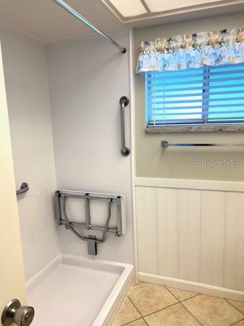3751 S School Ave Unit 29, Sarasota, FL 34239 - bathroom featuring tile patterned floors and a shower