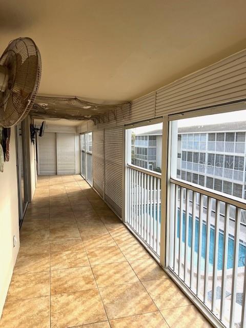 3751 S School Ave Unit 29, Sarasota, FL 34239 - corridor featuring tile patterned floors