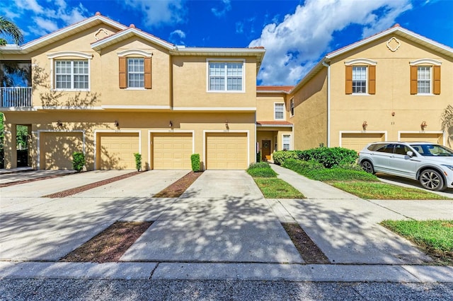 multi unit property featuring a garage