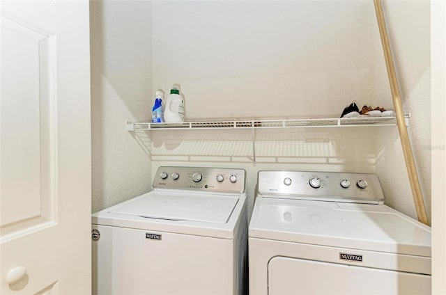 laundry room with washer and dryer