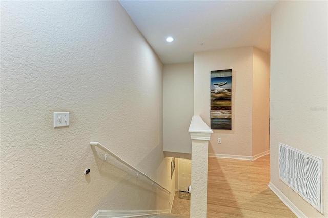 corridor featuring light hardwood / wood-style floors