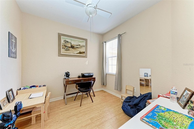 office area with light hardwood / wood-style floors and ceiling fan