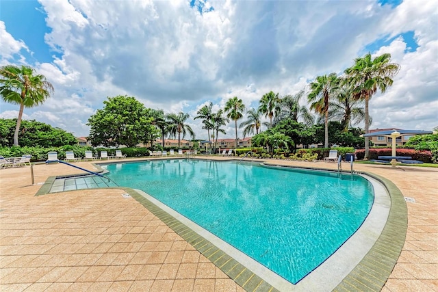 view of swimming pool with a patio