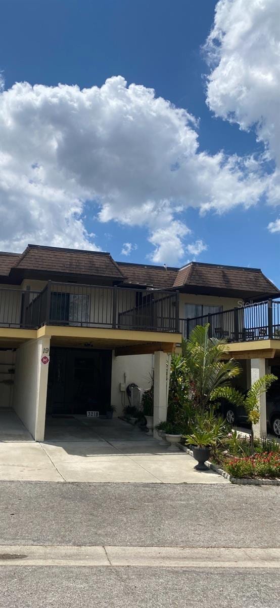 view of front of property featuring a wooden deck