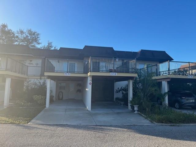 view of front of property with a carport