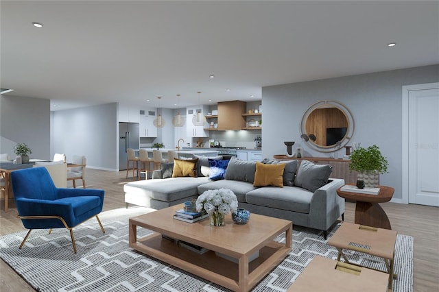 living room with baseboards, recessed lighting, and light wood-type flooring