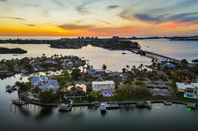 aerial view at dusk with a water view