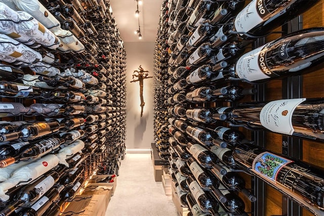 wine room featuring light carpet