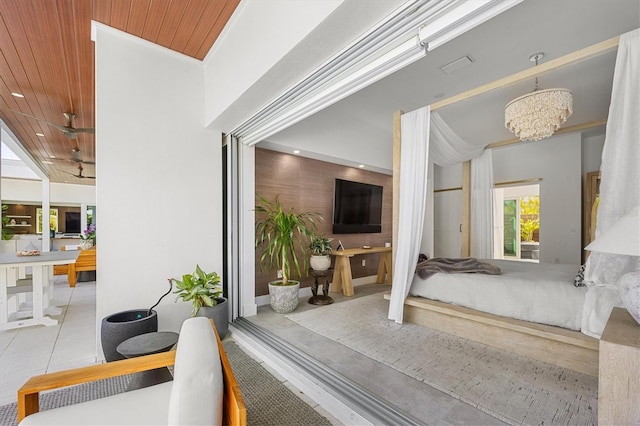 tiled bedroom featuring wood ceiling and a chandelier