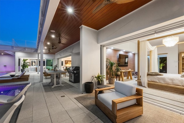 view of patio / terrace with ceiling fan, a grill, an outdoor hangout area, and a swimming pool