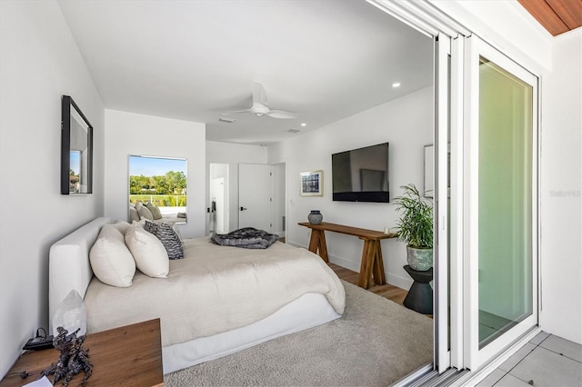 bedroom with light wood-type flooring and ceiling fan