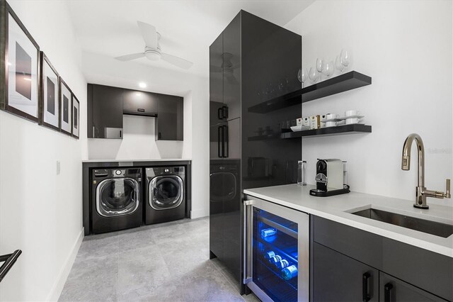 interior space featuring ceiling fan, washing machine and dryer, beverage cooler, and sink