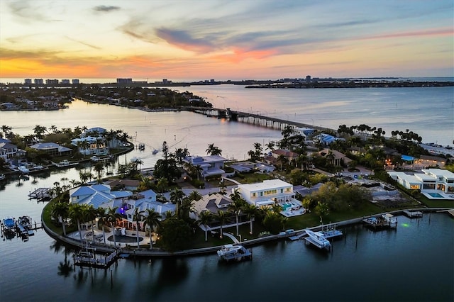 aerial view at dusk with a water view