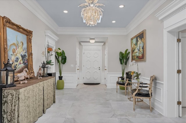 corridor with a notable chandelier and ornamental molding