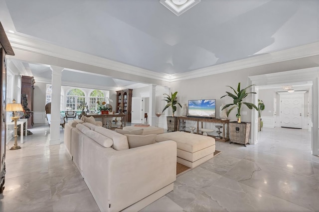 living room featuring ornate columns and ornamental molding