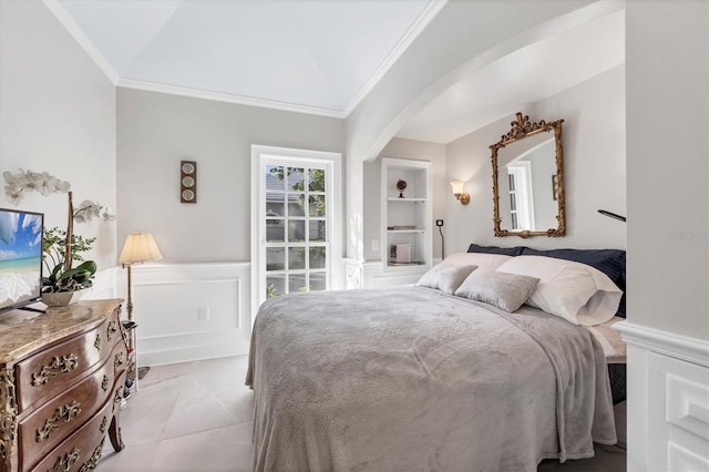 bedroom with vaulted ceiling and crown molding