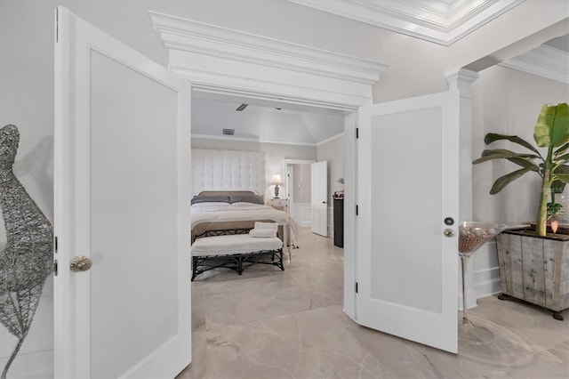 bedroom featuring ornamental molding and vaulted ceiling