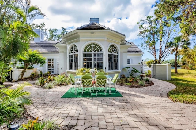 rear view of property featuring a patio