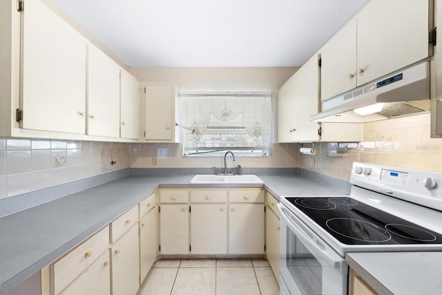 kitchen with decorative backsplash, sink, white electric stove, and light tile patterned floors