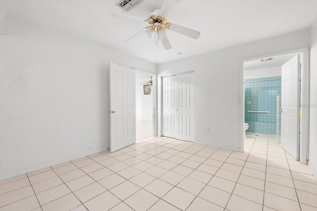 spare room with light tile patterned floors and ceiling fan