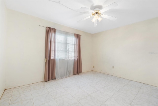 spare room featuring ceiling fan