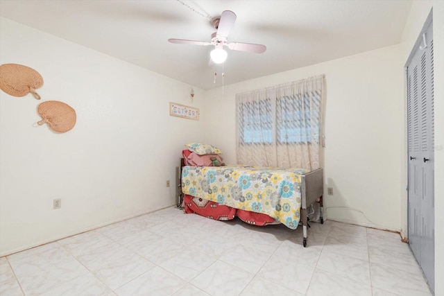 bedroom featuring a closet and ceiling fan