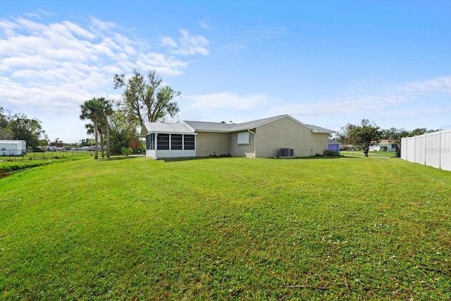 6352 Coniston Ter, North Port, FL 34287 - back of property featuring stucco siding and a sunroom