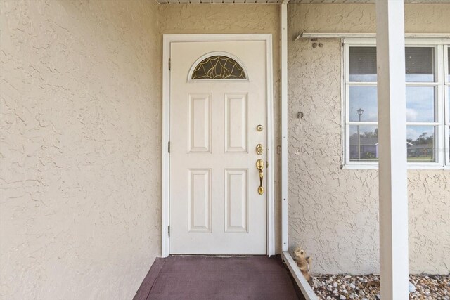 6352 Coniston Ter, North Port, FL 34287 - entrance to property with stucco siding
