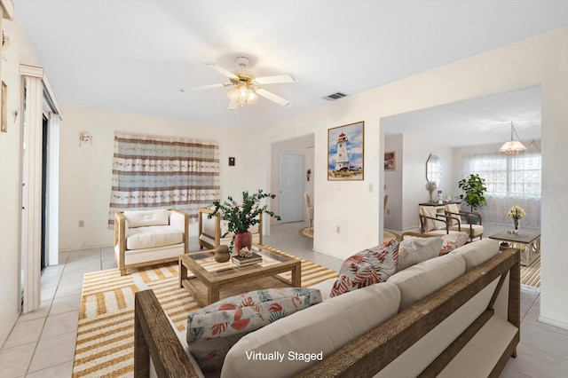 6352 Coniston Ter, North Port, FL 34287 - living room with light tile patterned floors and a ceiling fan