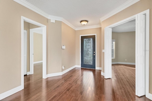 entryway featuring a textured ceiling, crown molding, and dark wood-type flooring