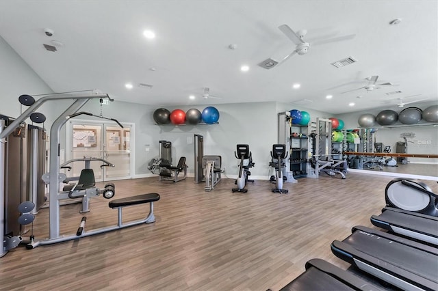 workout area featuring hardwood / wood-style flooring and ceiling fan